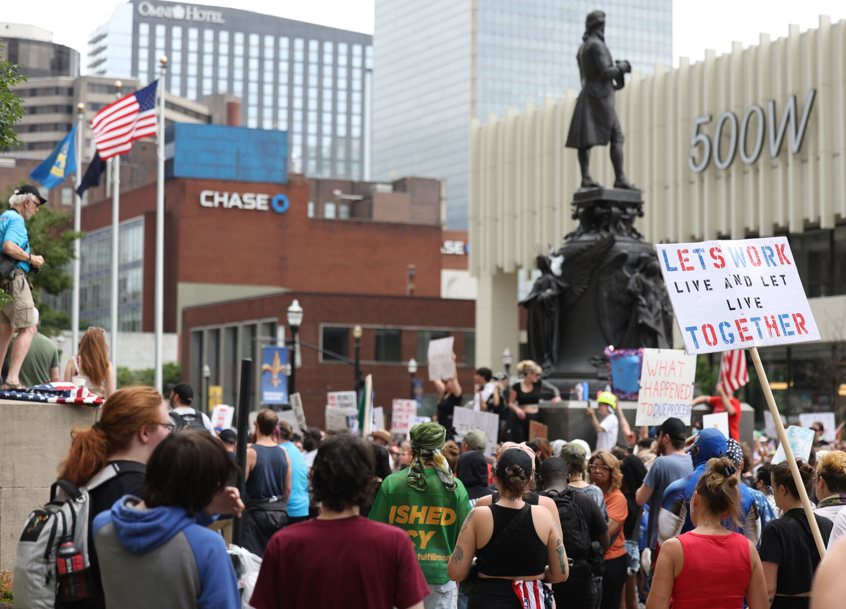 People stand near 500 W building.JPG